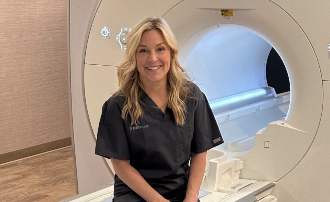 Jennifer Jolly sitting on the Prenuvo scanner about to start her full body MRI scan