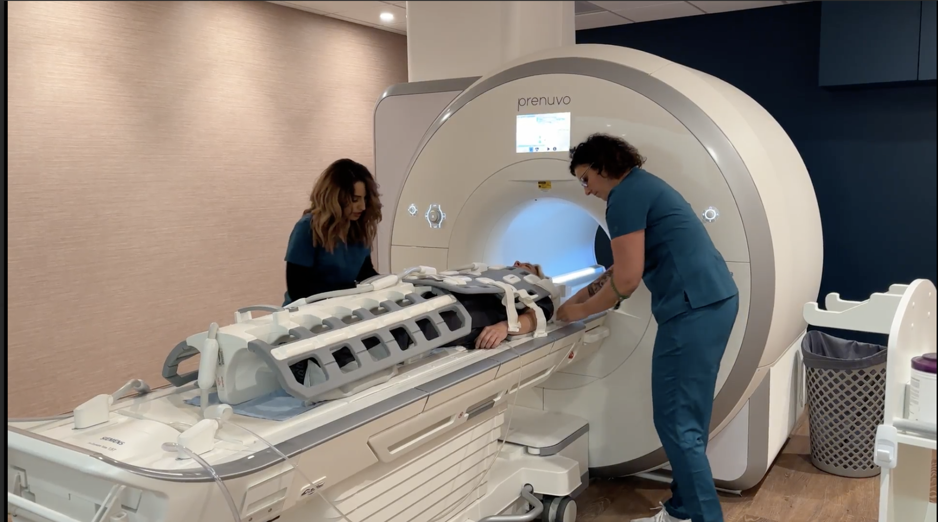 Me getting strapped into the Prenuvo MRI scanner